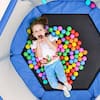 Blue mini trampoline with safety enclosure net and colorful balls inside