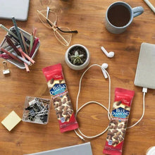 Almond snack tubes set with clips and cups on table