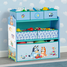 Blue children's toy storage organizer with three shelves and fabric storage bins