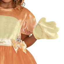 Close-up of orange dress with gold panel, attached bow and character gloves