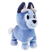 Light blue plush character with dark ears, white muzzle, and smiling face