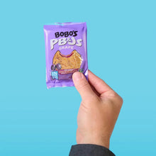 Bobo's PB&J grape oat snack packet held in a hand
