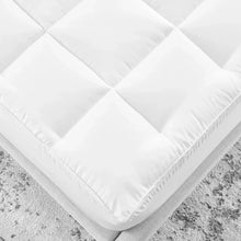 White quilted mattress topper corner with stitched edges and plush fill