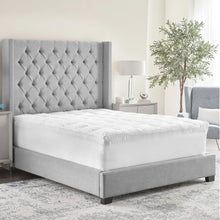 4-inch mattress topper with white quilted cover and wavy stitching, full bed size