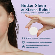 Body Restore lavender shower steamer tablet held in hand, round white tablet