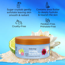 Bodycology resting beach face exfoliating sugar scrub jar with orange lid, blue label