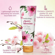 Cherry blossom body cream tube with gold cap and lightweight moisturizing label icons