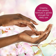Hands spreading creamy body cream, smooth non-greasy texture for daily use