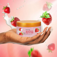 Hand holding Bodycology strawberry cheesecake exfoliating sugar scrub jar, pink with gold lid