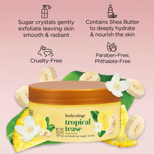Bodycology Tropical Tease exfoliating sugar scrub jar surrounded by banana and flower accents.