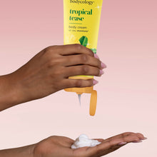 Body cream tube dispensing dollop onto hand
