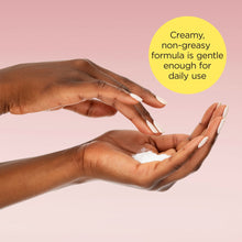 Body cream being rubbed into hands