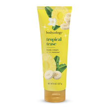 Body cream tube with yellow design and tropical leaf and flower accents