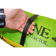 Archery target bag strap held by hand; lime and yellow panels with “BONE COLLECTOR” text
