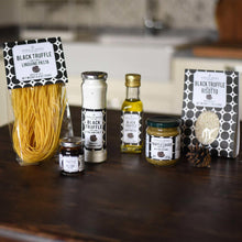 Black truffle pantry set assortment: pasta, oil, sauce jars, and risotto packet