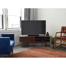 Black Bose soundbar on media console