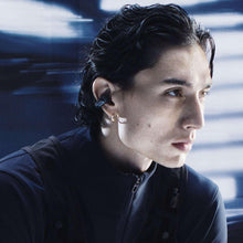 Bose open-ear earbuds worn in one ear, dark earcup with slim profile