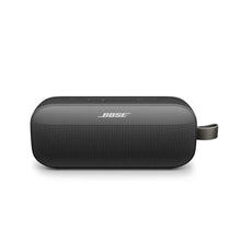 Black portable Bluetooth speaker with fabric grille and side carry strap