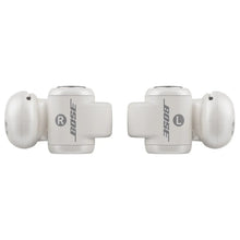 Open-ear earbuds with white outer housings and Bose logo, charging case
