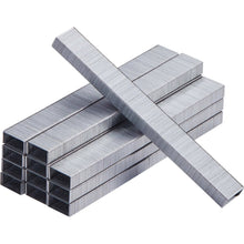 Chisel-point metal staples arranged in a cross, silver-gray finish