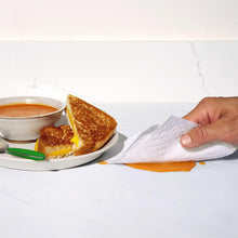 Bounty Advanced paper towel wiping up orange sauce spill on countertop
