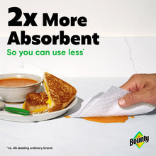 White paper towel sheet blotting liquid on a plate, 2-ply Select-A-Size