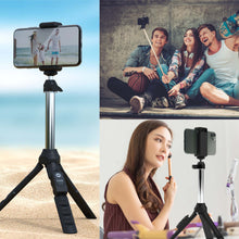 Black selfie tripod with smartphone mount, adjustable legs, and wireless remote