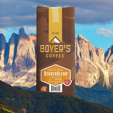 Boyer's Coffee DenverBlend whole bean light roast bag in front of mountains.
