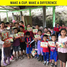 Coffee package boxes held in a group, outdoor giveaway