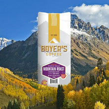 Whole bean coffee bag, Mountain Roast Decaf Dark Roast, with white and gold label