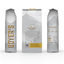 Three whole bean coffee bags displayed side by side with gold vertical branding