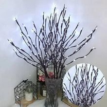 Lighted willow branch twigs with warm white LEDs in a clear vase