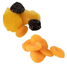 Dried fruit pieces, including orange slices and dark prunes