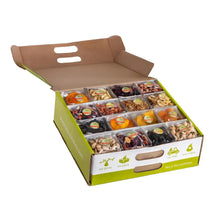 Open snack box with multiple compartments and small packaged treats inside