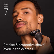 Braun Series 7 electric shaver used on face, black and silver foil head