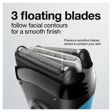 Electric shaver foil head close-up showing three floating blades.