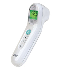 White digital infrared thermometer angled view with green LCD temperature