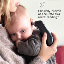Caregiver holding black ear thermometer against a child’s ear