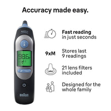 Black Braun ear thermometer with green LCD display and blue control buttons