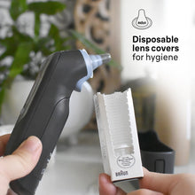 Black ear thermometer with disposable lens cover fitted on probe tip