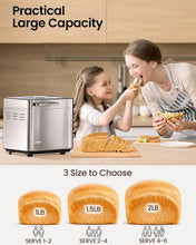 Silver bread maker showing 1 lb, 1.5 lb, and 2 lb loaf capacity options