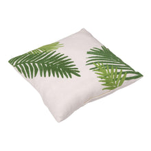 Decorative indoor/outdoor pillow with white cover and green palm leaf print