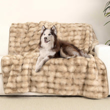 Oversized pet blanket with plush bubble fur in beige, draped on sofa with dog