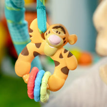 Hanging cartoon plush toy with rattling rings on bouncer activity arch
