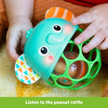 Close-up of teal elephant light-up rattle with green ring and multicolor ear panels