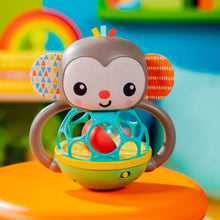 Monkey multi-sensory toy with plush gray face, teal cage, and green base
