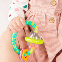 Grab-and-spin rattle/teether with clear drum, lime green bar, pink and orange accents