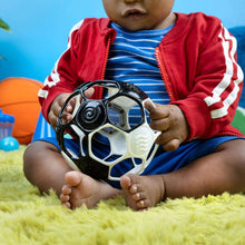 Black and white soccer ball rattle toy with spiral imprint and molded grip handles