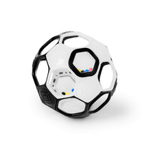 Black and white soccer ball rattle toy with grip handles and window detail