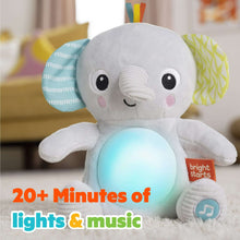 Gray plush elephant baby soother close-up with glowing belly light and blue music icon